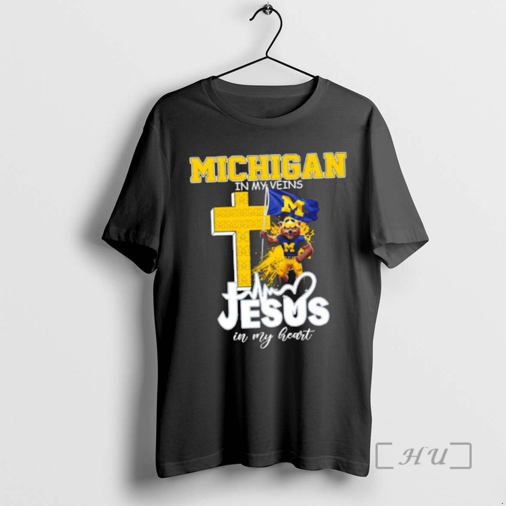 Officials Mascot Hold Flag Michigan Wolverines In My Veins Jesus In My Heart Premium T-Shirts, Hoodie, Sweatshirt