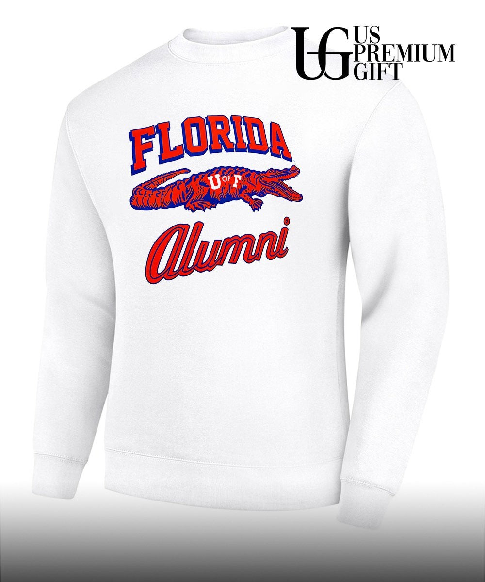 Tim Tebow wearing University of Florida Alumni shirt