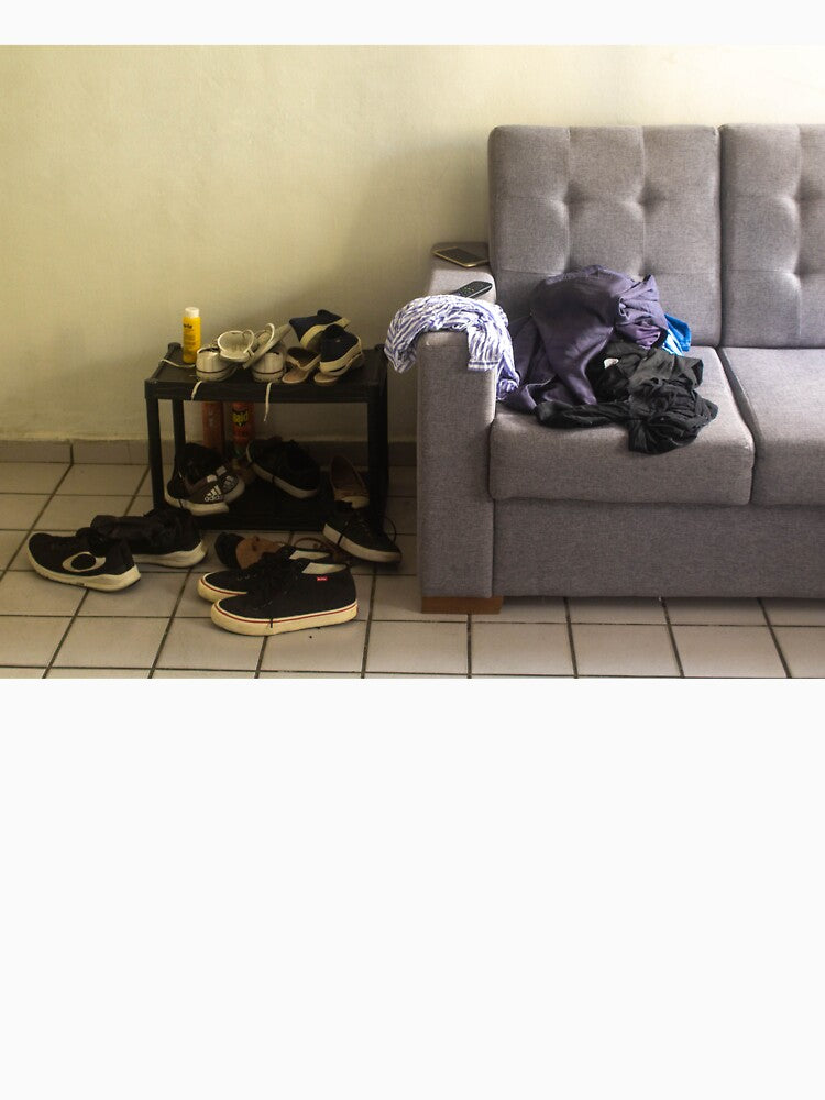 room with shoes and sofa by felipequeiroz